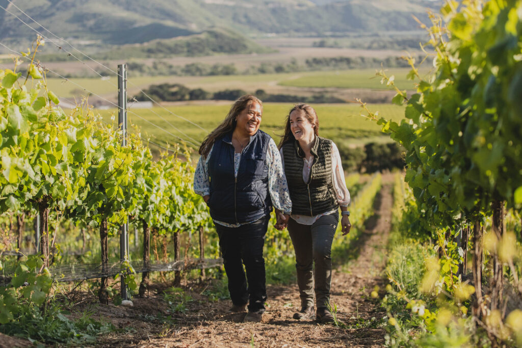 Tara Gomez and wife Mireia in vineyard