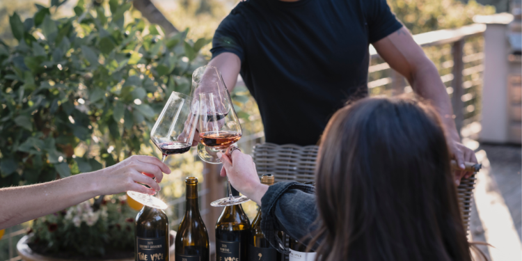 Malek Amrani, winemaker toasting with guests