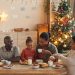 Family sharing breakfast on Christmas morning, reflecting mindful holiday wellness tips.