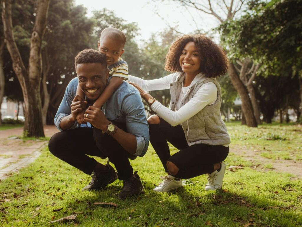 A family enjoying a lively day at the park, engaging in activities that boost their endorphin levels and support their parasympathetic nervous system.