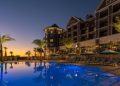 Luxury poolside view at Henderson Beach Resort at sunset.
