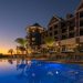 Luxury poolside view at Henderson Beach Resort at sunset.