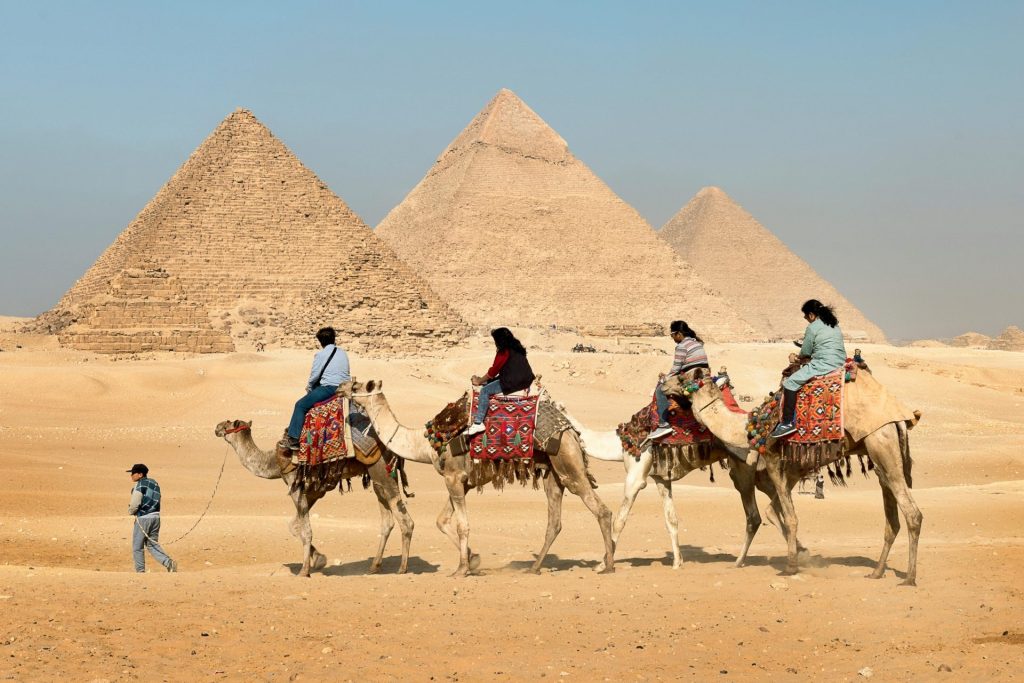 Riding camels in Egypt